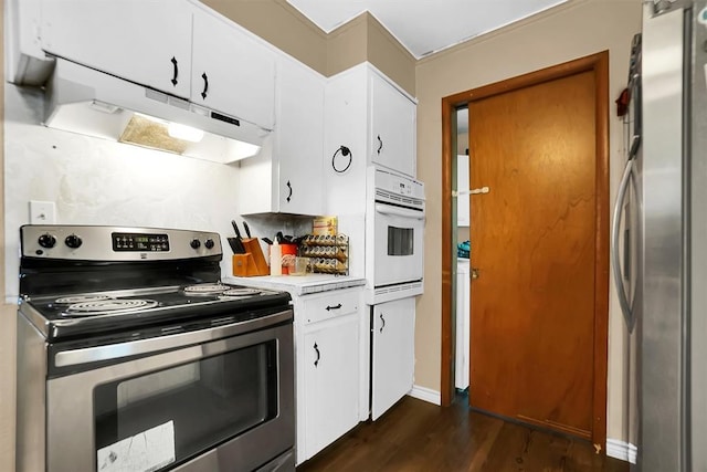 kitchen featuring white cabinetry, dark wood-type flooring, and appliances with stainless steel finishes