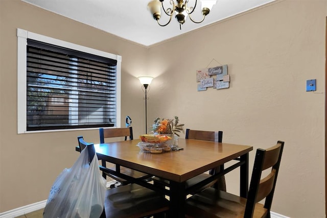 dining area featuring an inviting chandelier