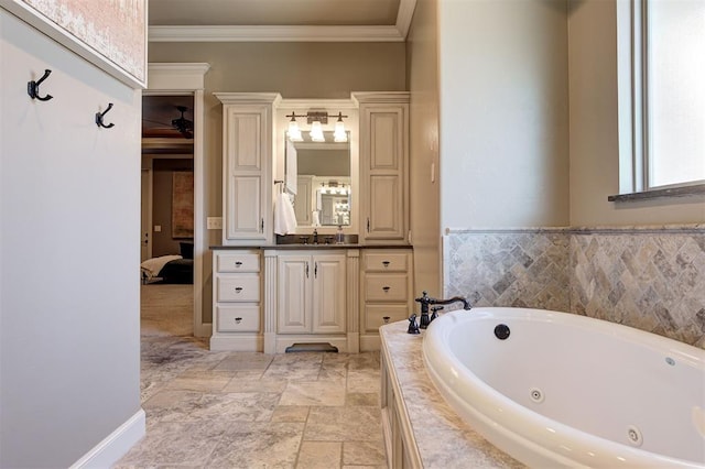 bathroom with vanity, ornamental molding, and tiled tub