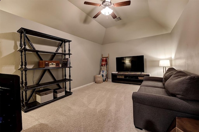 carpeted living room featuring vaulted ceiling and ceiling fan