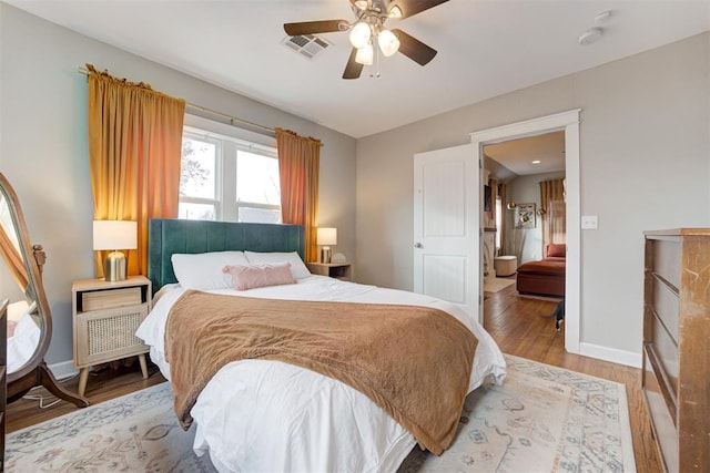 bedroom featuring light wood-type flooring and ceiling fan