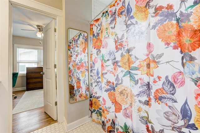 bathroom featuring hardwood / wood-style flooring and ceiling fan