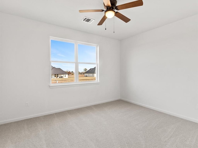 empty room with carpet and ceiling fan