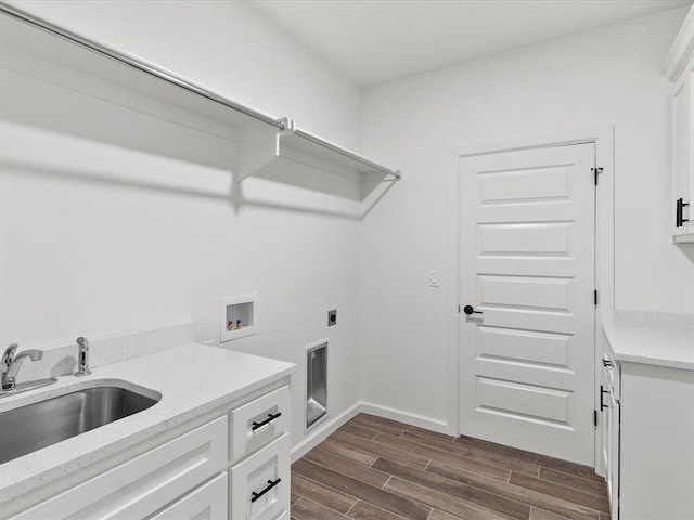 laundry area with cabinets, hookup for a washing machine, hookup for an electric dryer, dark wood-type flooring, and sink