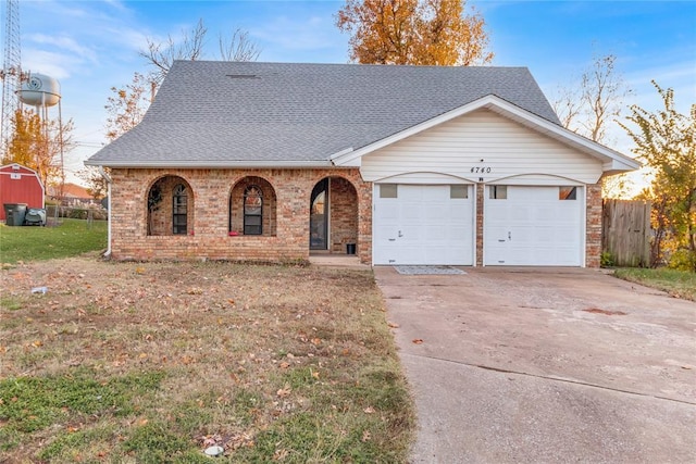 ranch-style house with a front yard and a garage