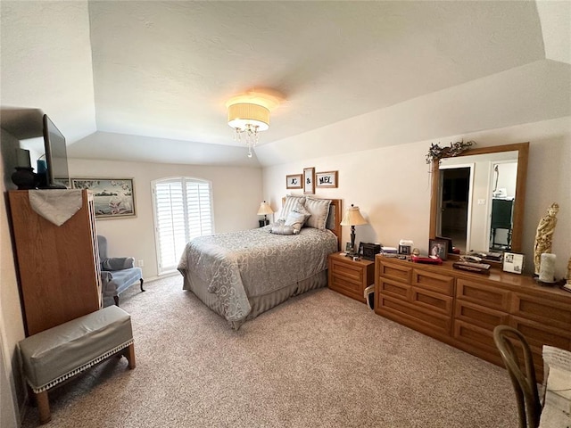 bedroom featuring carpet and lofted ceiling