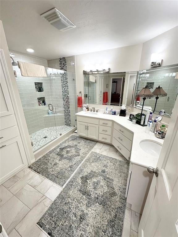 bathroom with vanity and walk in shower