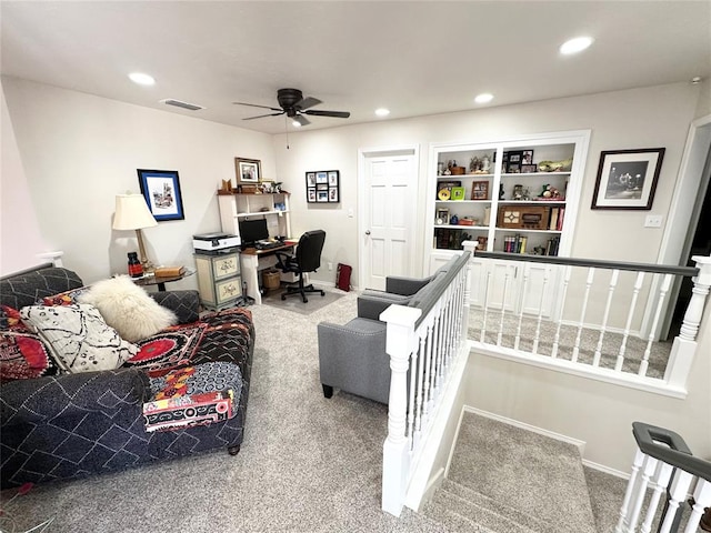 living room with carpet floors and ceiling fan