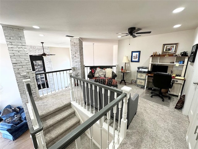 interior space featuring carpet flooring and ceiling fan