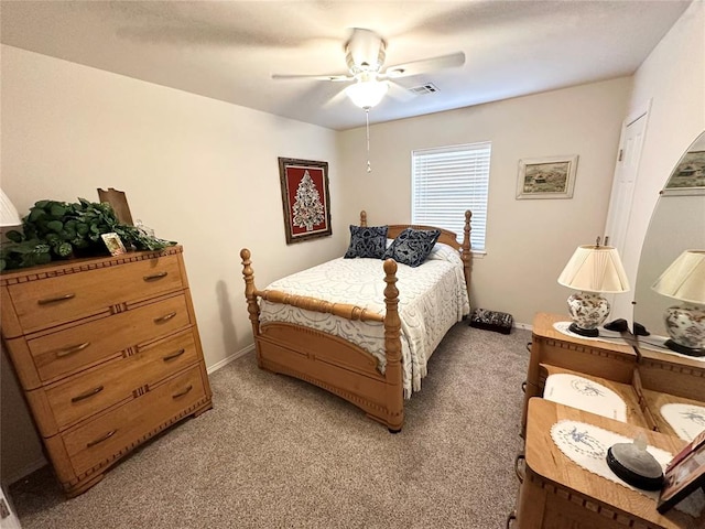 bedroom featuring ceiling fan and light colored carpet