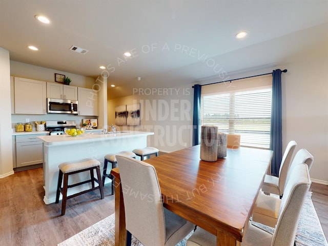 dining area featuring light hardwood / wood-style flooring