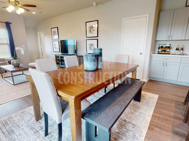 dining space with ceiling fan and light hardwood / wood-style floors