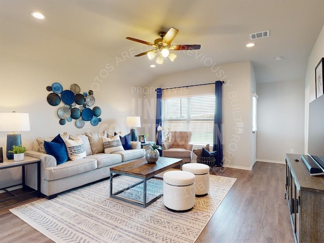 living room with hardwood / wood-style flooring, ceiling fan, and lofted ceiling