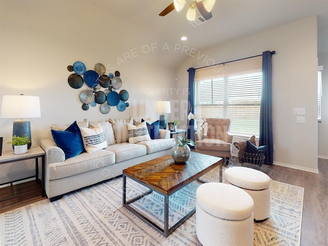 living room with ceiling fan, vaulted ceiling, and hardwood / wood-style flooring