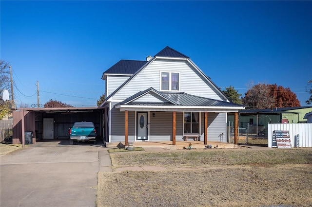 view of front of property with a porch and a carport