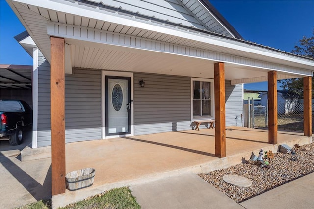 property entrance featuring covered porch