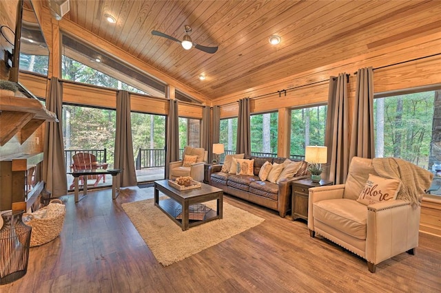 living room featuring ceiling fan, plenty of natural light, wood ceiling, and wood-type flooring