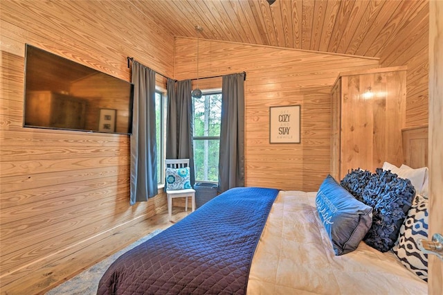 bedroom with wooden walls, lofted ceiling, and wood ceiling