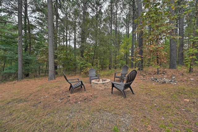 view of yard with an outdoor fire pit