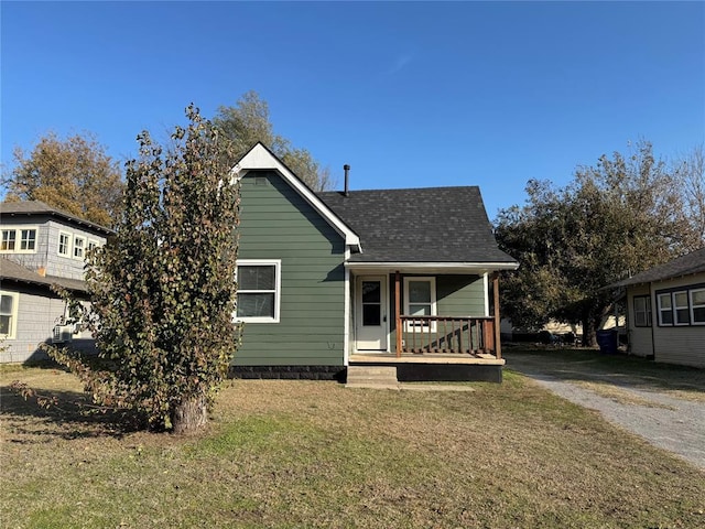 view of front facade with a porch and a front yard