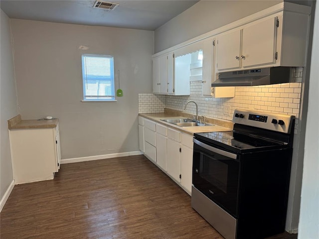 kitchen featuring stainless steel electric stove, sink, white cabinetry, and dark wood-type flooring