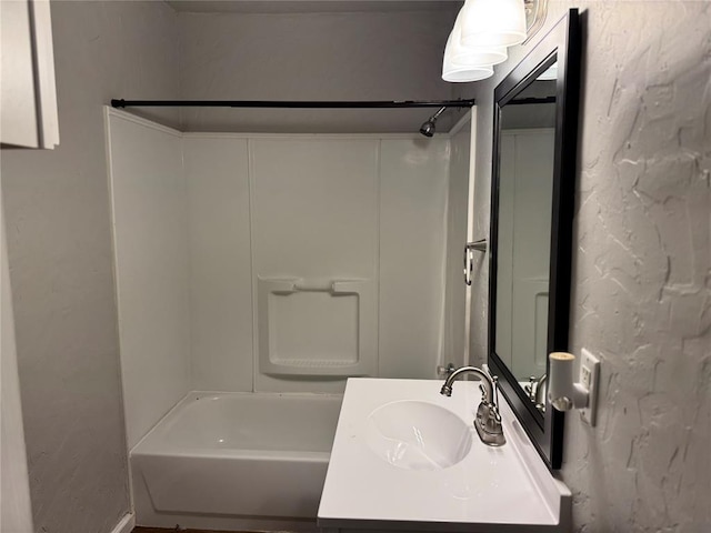 bathroom with vanity and shower / bathtub combination