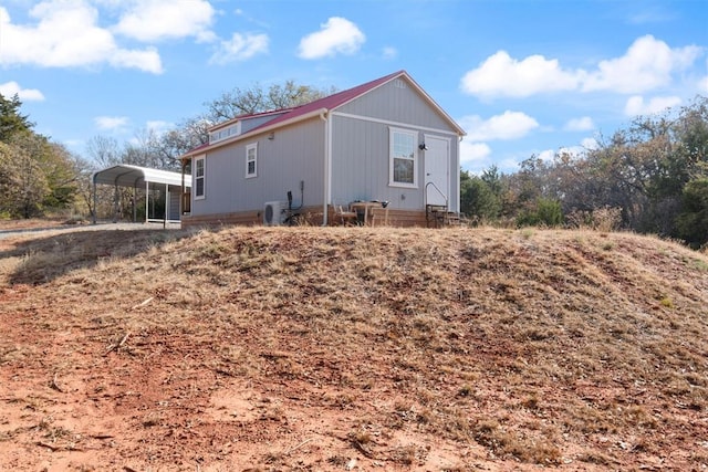 view of home's exterior with a carport