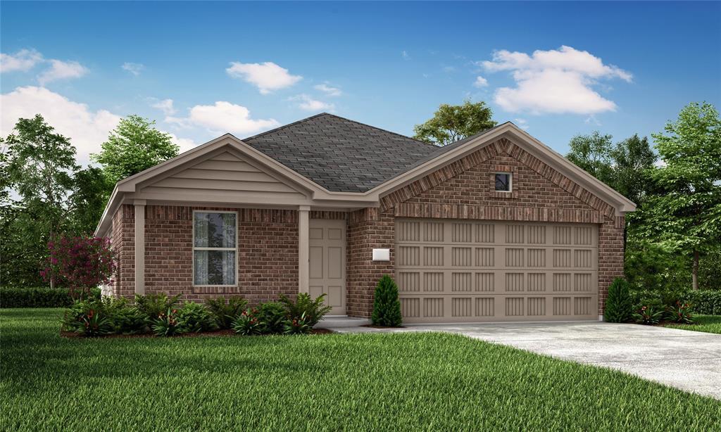 view of front of property featuring a front yard and a garage