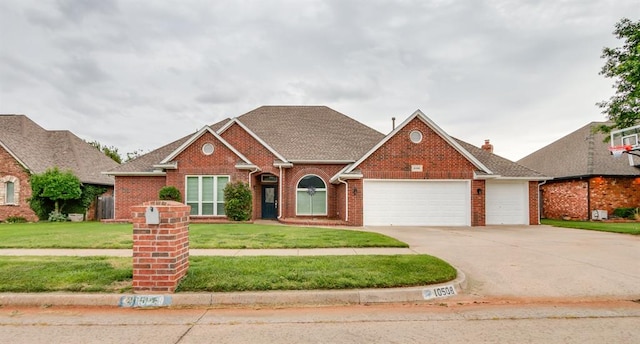 view of front facade with a front lawn and a garage