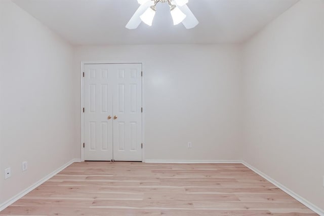 empty room featuring light hardwood / wood-style flooring and ceiling fan