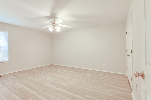 spare room featuring ceiling fan and light hardwood / wood-style flooring