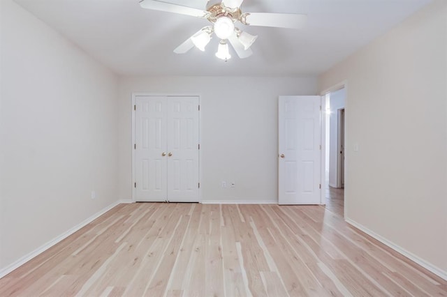 unfurnished room with ceiling fan and light hardwood / wood-style flooring