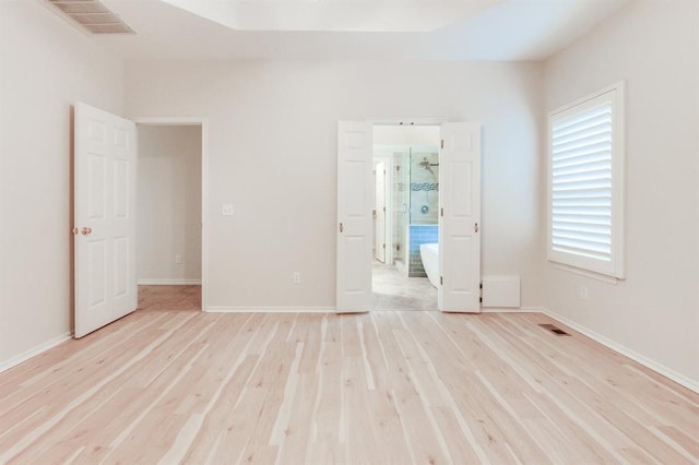 unfurnished bedroom featuring light wood-type flooring