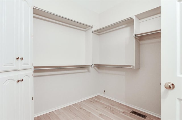 walk in closet featuring light wood-type flooring