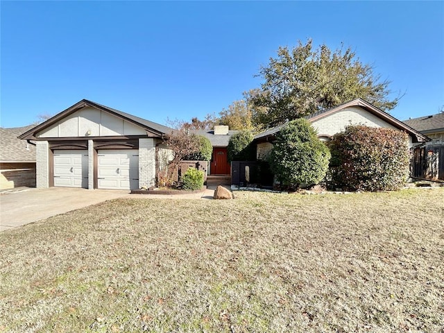 view of front of house featuring a front lawn and a garage