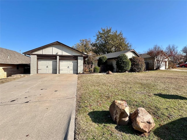 ranch-style home with a garage and a front yard