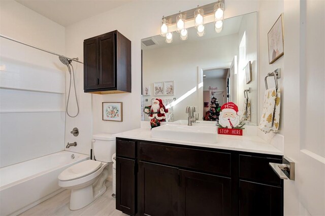 full bathroom with vanity, wood-type flooring, shower / bathtub combination, and toilet