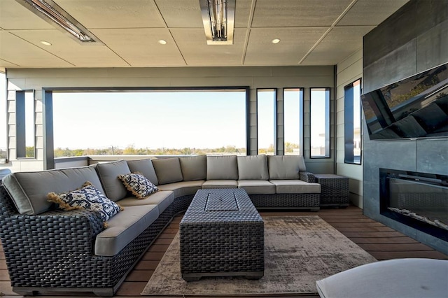 view of patio with an outdoor living space and a wooden deck