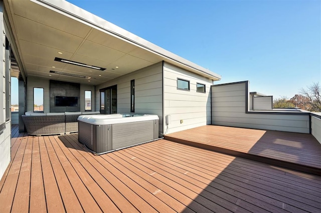 wooden terrace featuring a hot tub