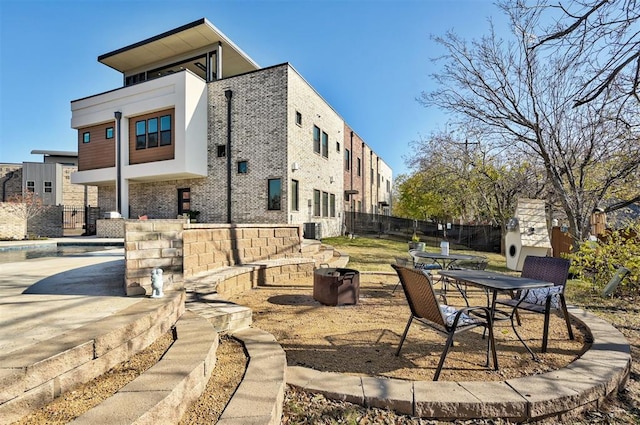 view of patio with central AC and a swimming pool