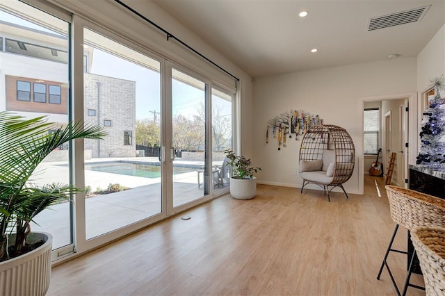 doorway to outside with light hardwood / wood-style floors