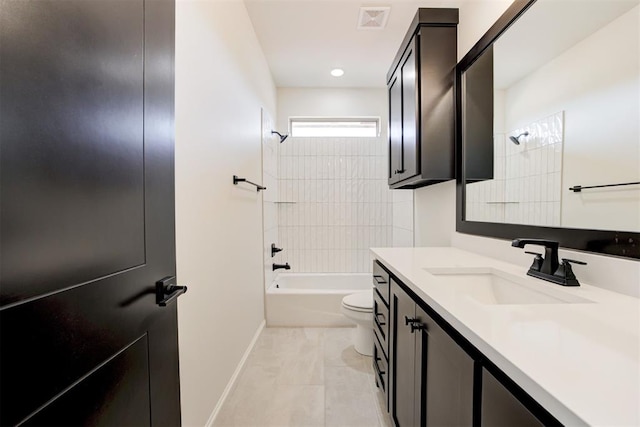 full bathroom featuring tile patterned floors, toilet, vanity, and tiled shower / bath