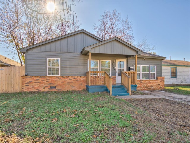 single story home featuring a front yard