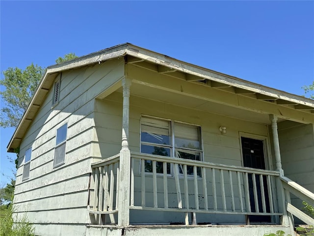 view of home's exterior featuring a porch
