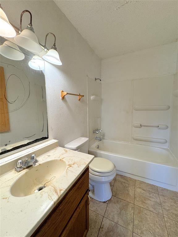 full bath featuring toilet, a textured ceiling, bathtub / shower combination, vanity, and tile patterned flooring