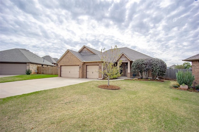 view of front of house featuring a front yard and a garage