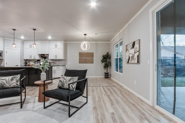 interior space featuring light hardwood / wood-style floors and crown molding