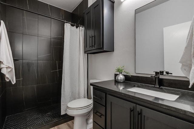 bathroom with hardwood / wood-style floors, vanity, toilet, and a shower with shower curtain