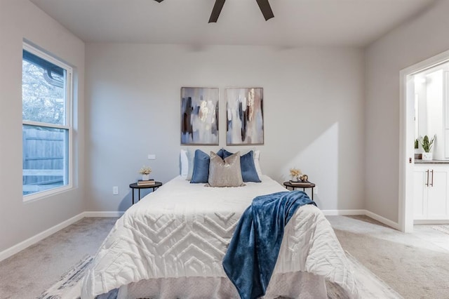 bedroom with ceiling fan and light colored carpet