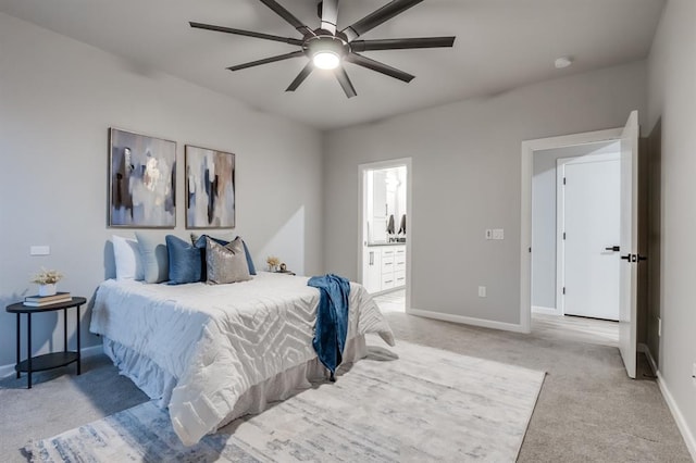 carpeted bedroom featuring connected bathroom and ceiling fan